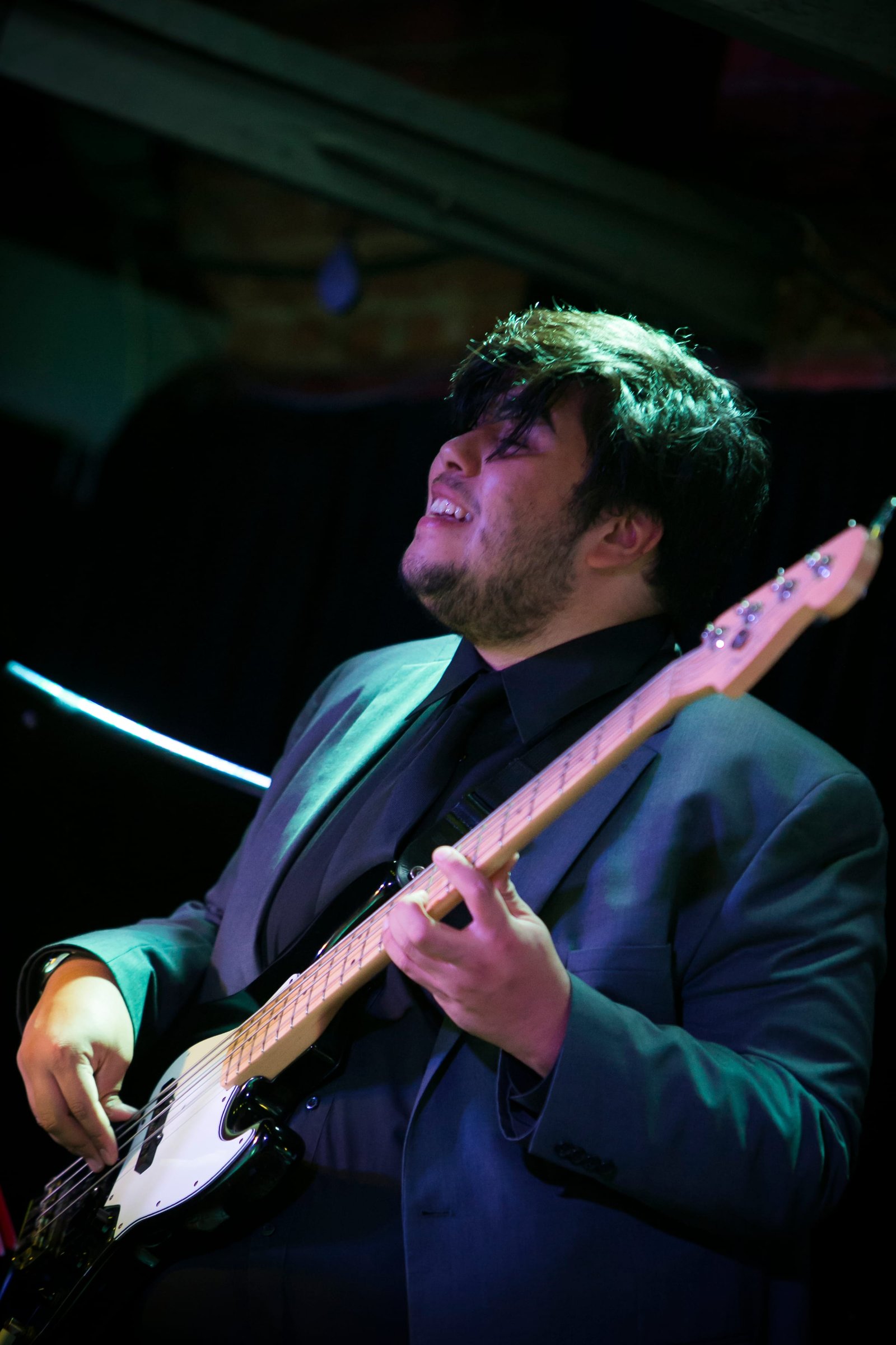 A student playing electric bass at the Music Now concert
